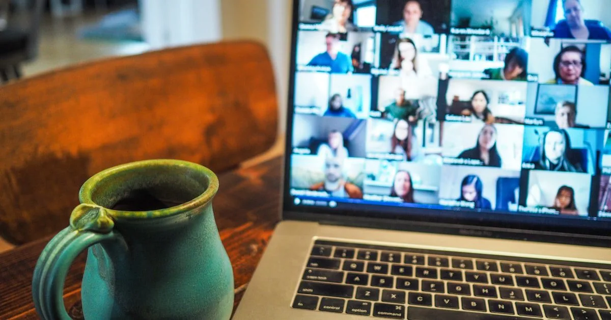 Person using tablet for online psychiatry session from comfortable home setting